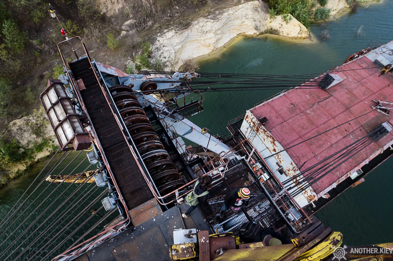 view from the top of flooded abandoned open mining digger