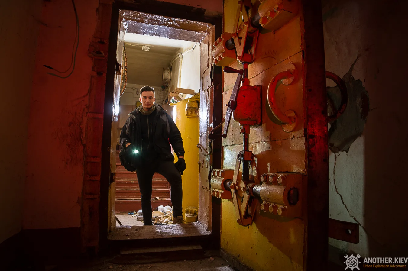 urban explorer on the entrance to the bunker