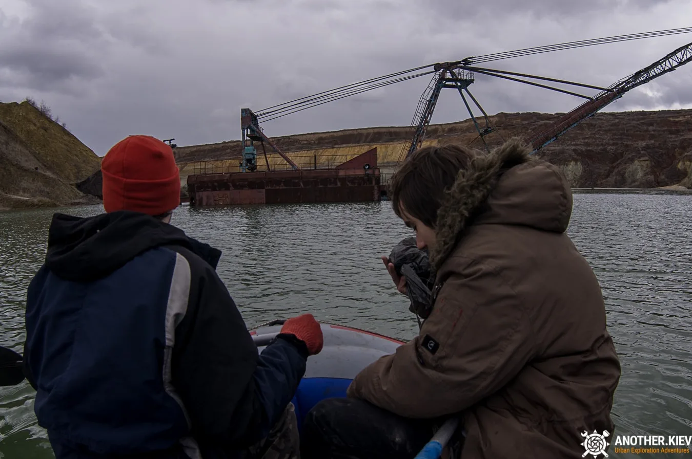 we float on an inflatable boat to a submerged excavator