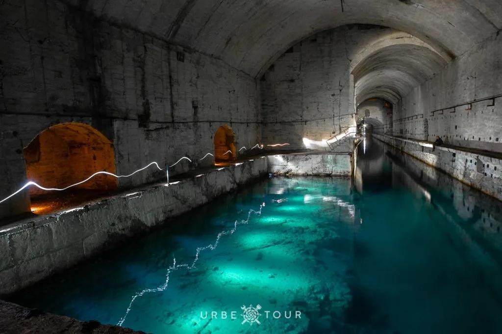 aqua blue water inside abandoned albanian submarine base